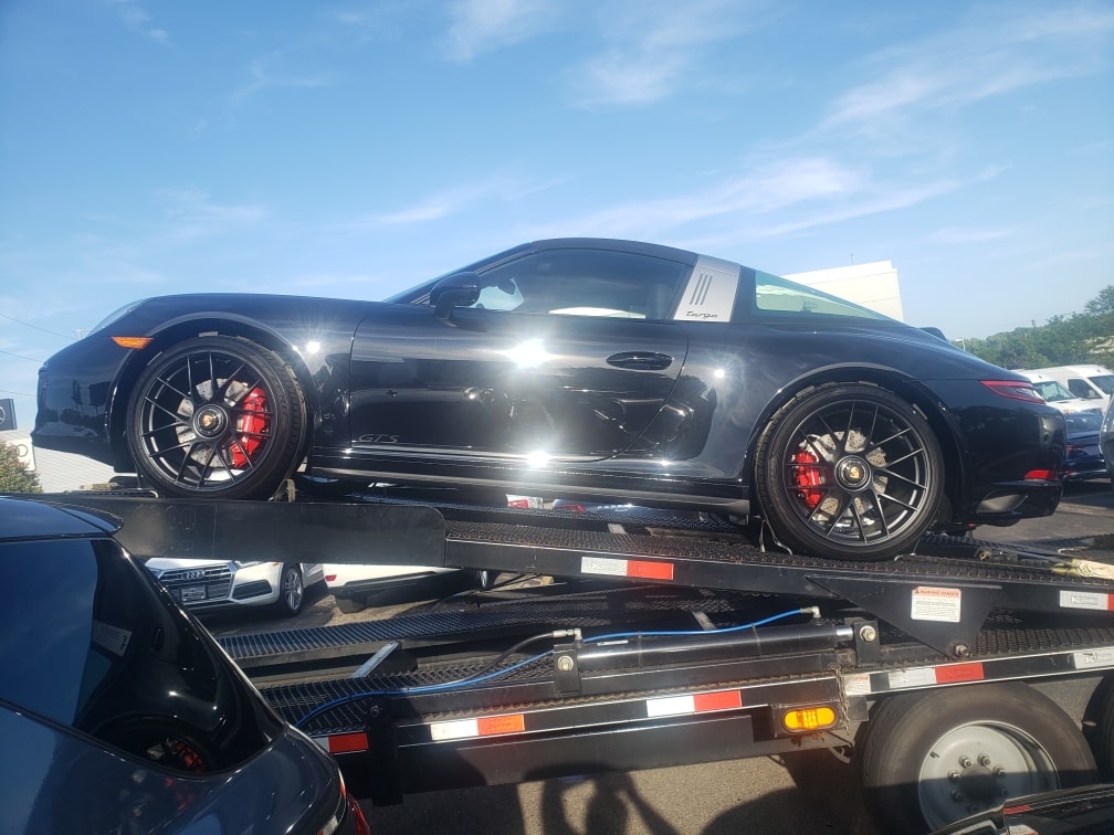 black porsche targa on trailer for auto transport