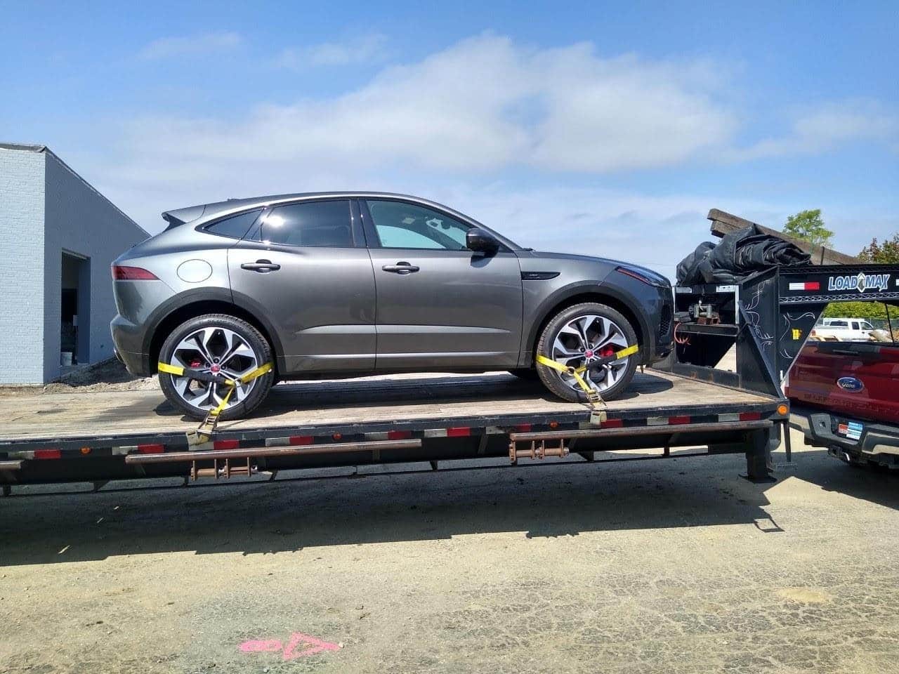 grey jaguar on a flatbed