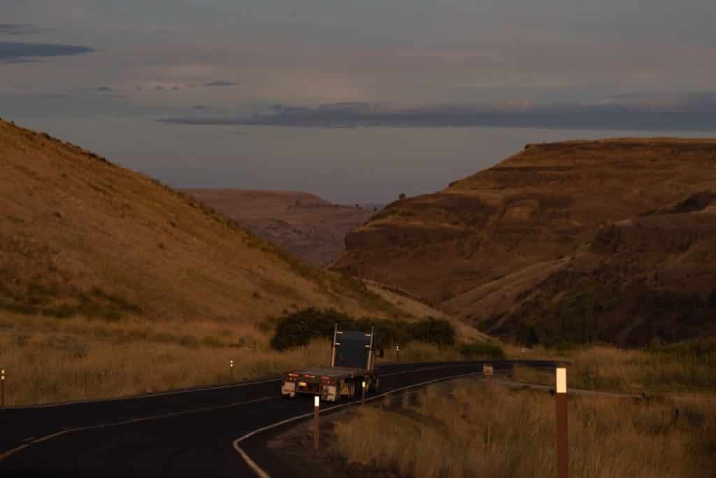 pic of semi-truck driving on the road
