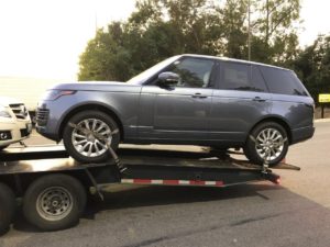land rover on open trailer