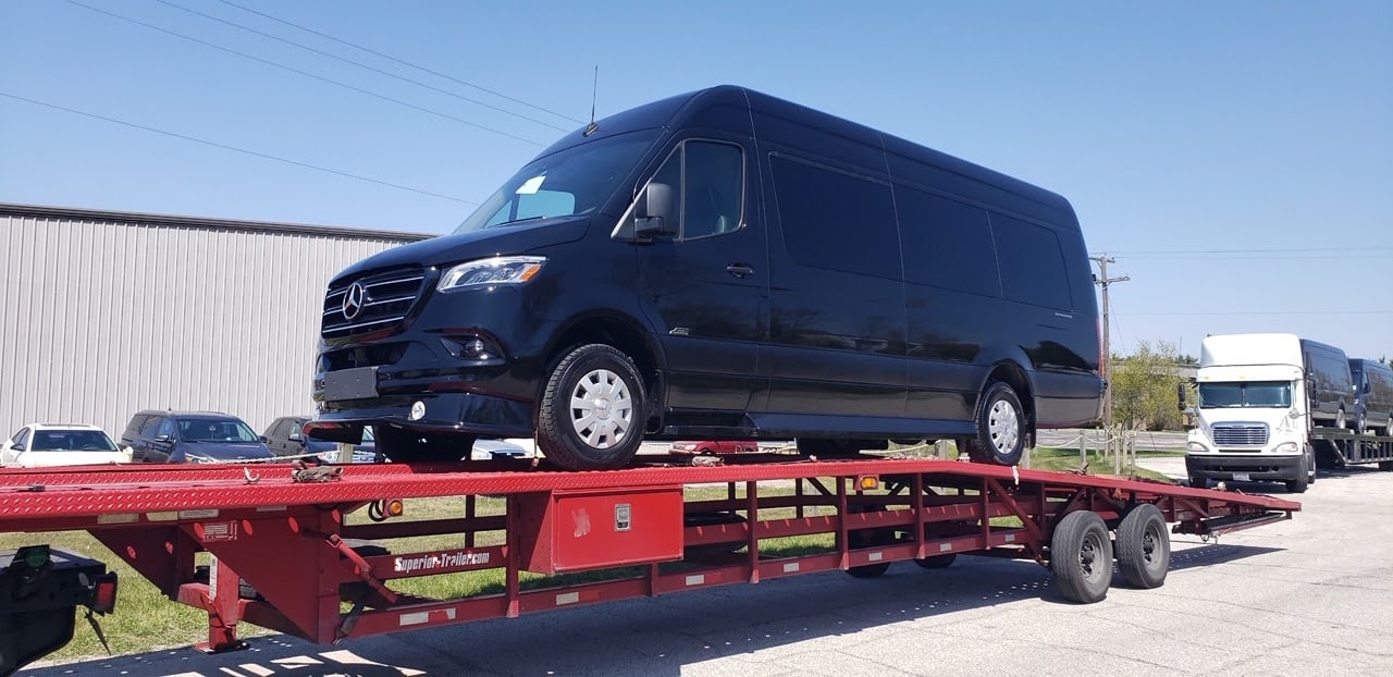 mercedes sprinter van on open trailer