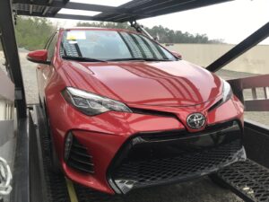 red toyota prius loaded for transport