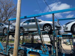 toyota camry on open trailer