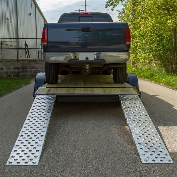 ford truck on trailer ramps for truck transport