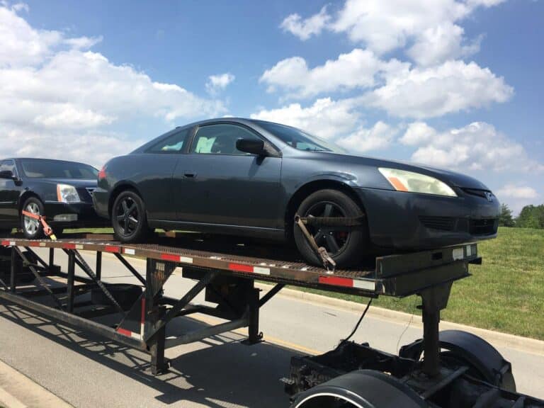 honda accord on open trailer