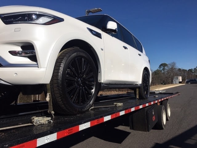 2020 infiniti QX80 SUV on trailer