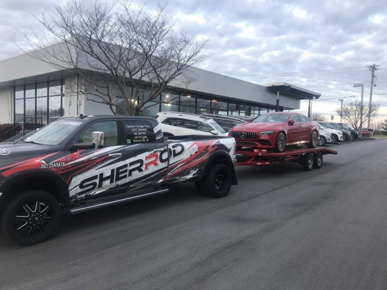 red mercedes gt coupe on trailer for car shipping