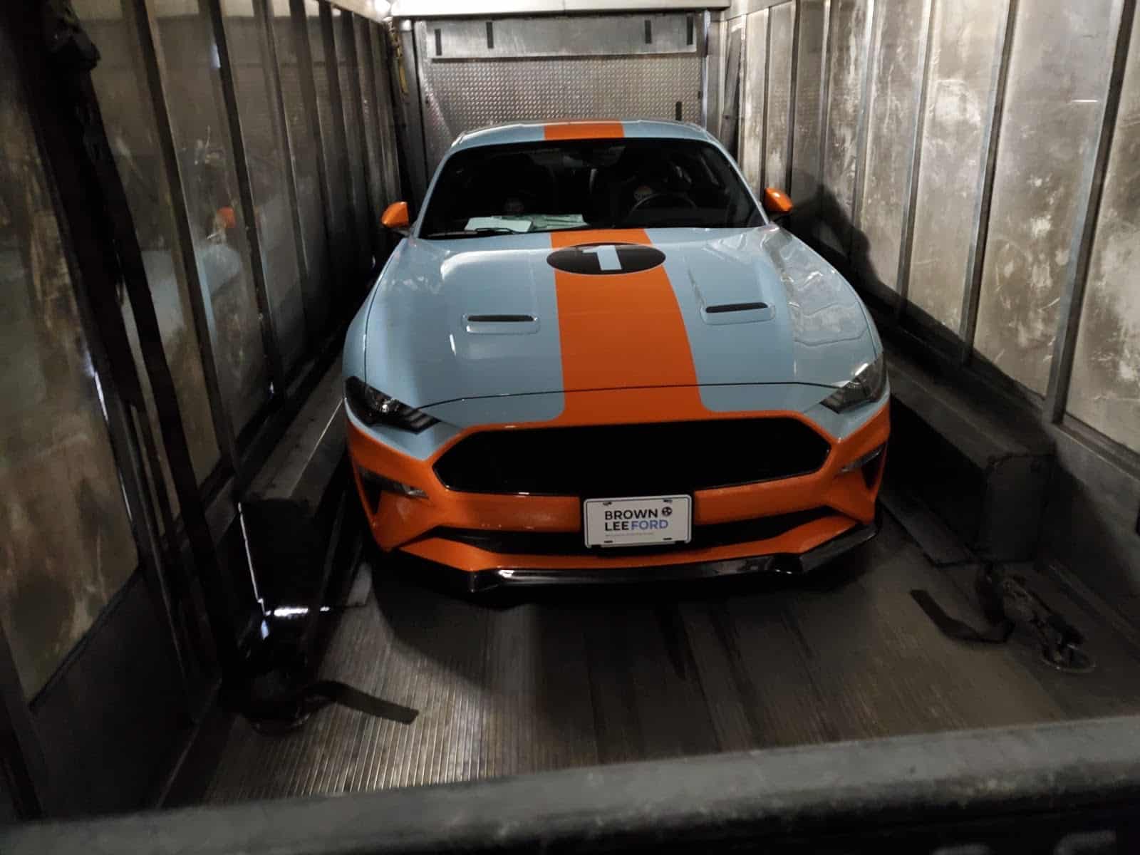 ford mustang in a closed trailer