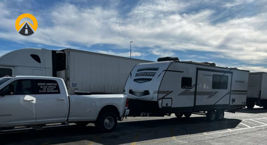 white rv trailer being pulled by a truck