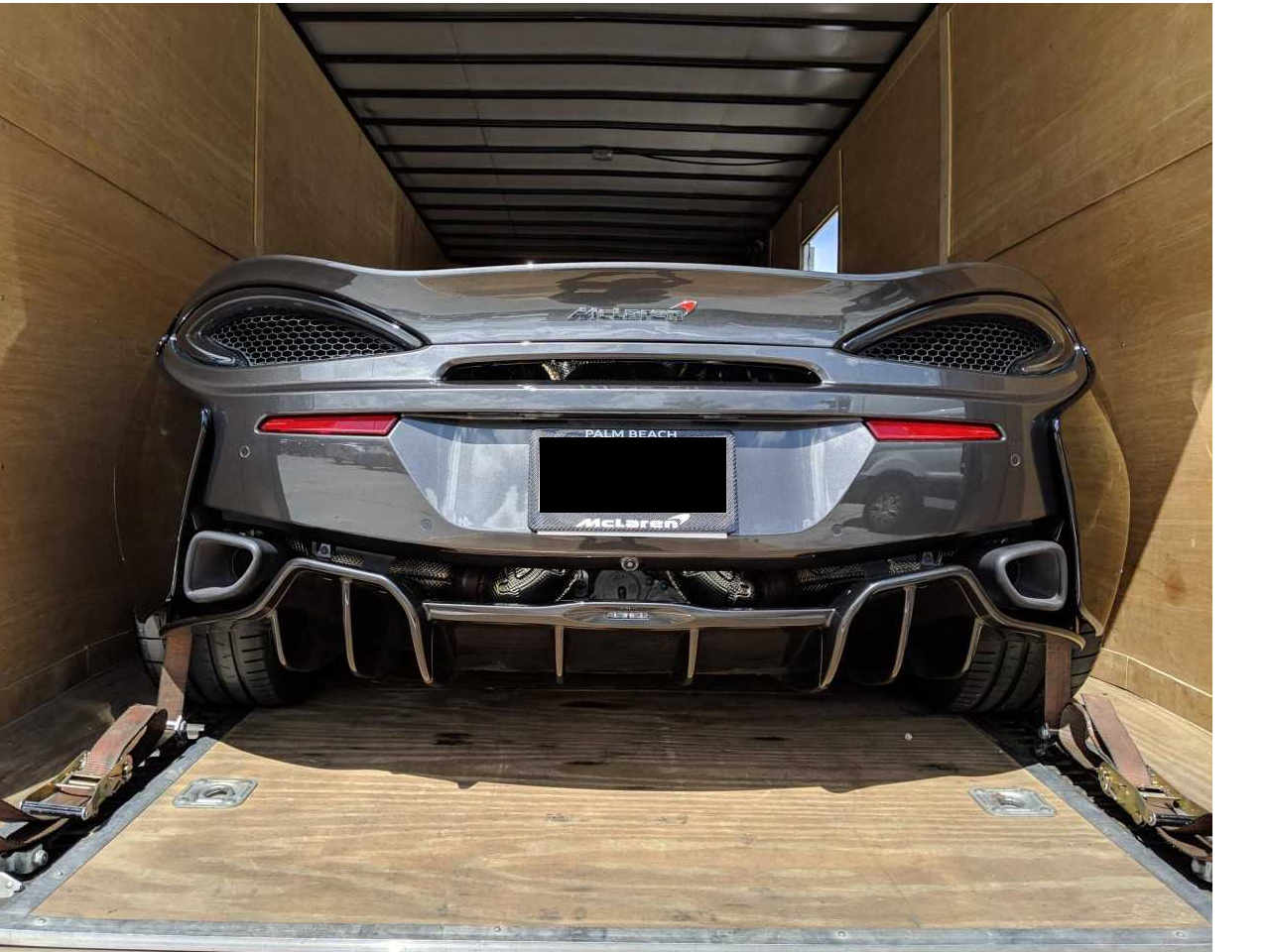 Nationwide car shipping by states service - open carrier loading vehicles for interstate transport