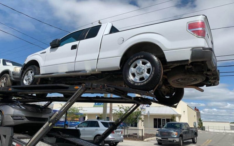 white commercial truck on trailer for auto transport